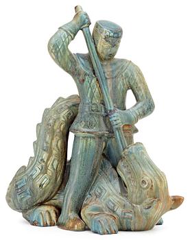 302. A Gunnar Nylund stoneware sculpture of S:t Michael and the dragon, Rörstrand.