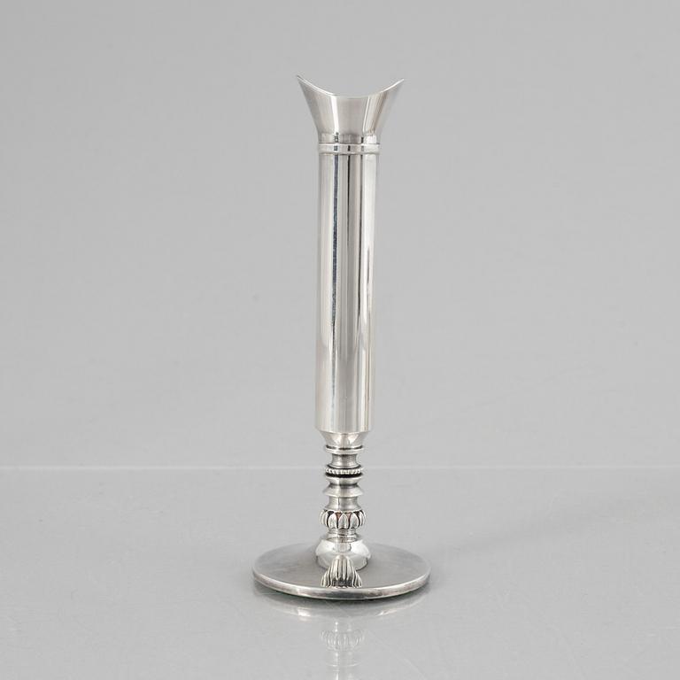 Eric Löfman, a Swedish silver candlestick, a vase and four cups, including MGAB, Uppsala 1977.