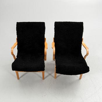 Bruno Mathsson, armchairs, a pair, "Eva", Bruno Mathsson International, Värnamo, second half of the 20th century.