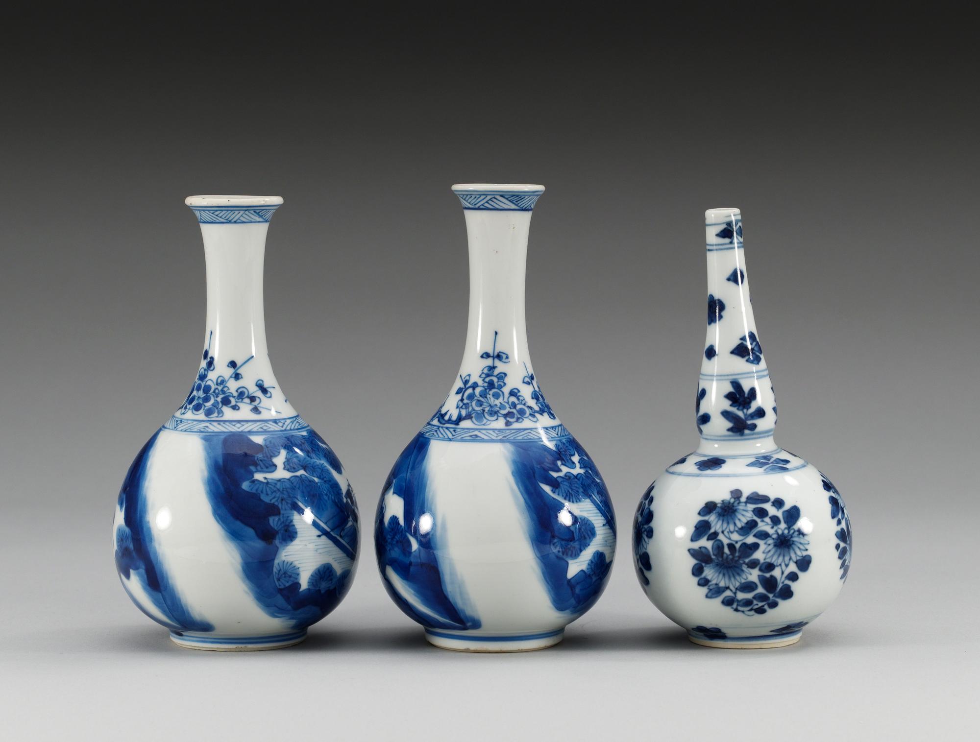 A pair of blue and white vases and a water sprinkler, Qing dynasty, Kangxi (1662-1722).