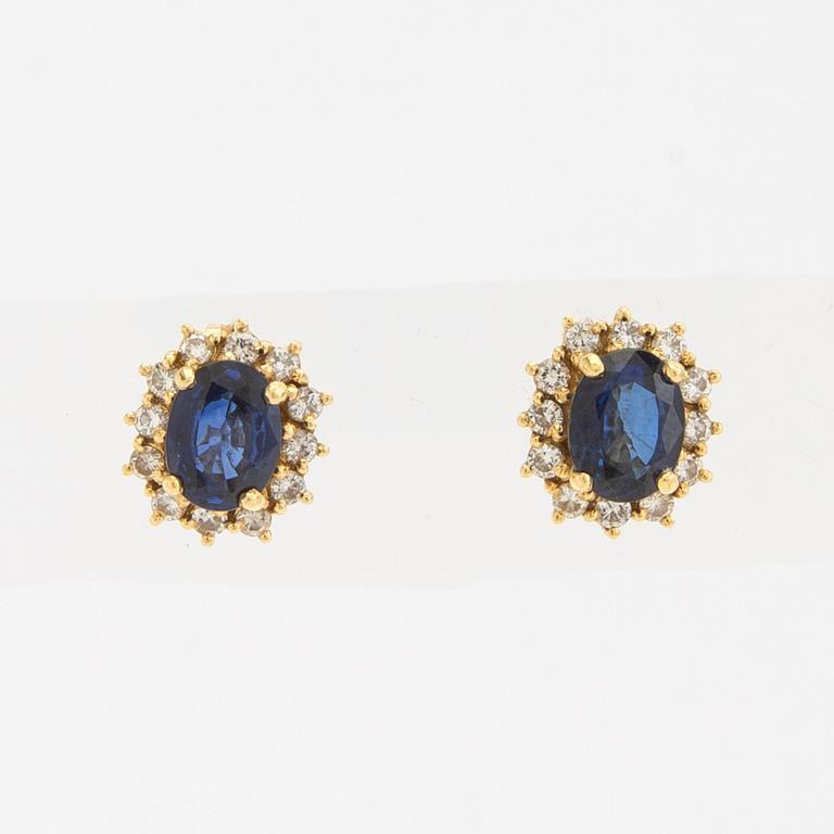 Earrings, a pair of 18K gold set with oval faceted sapphires and round brilliant-cut diamonds.