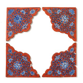 922. A set of four underglaze blue and red tiles, Qing dynasty, 18th century.