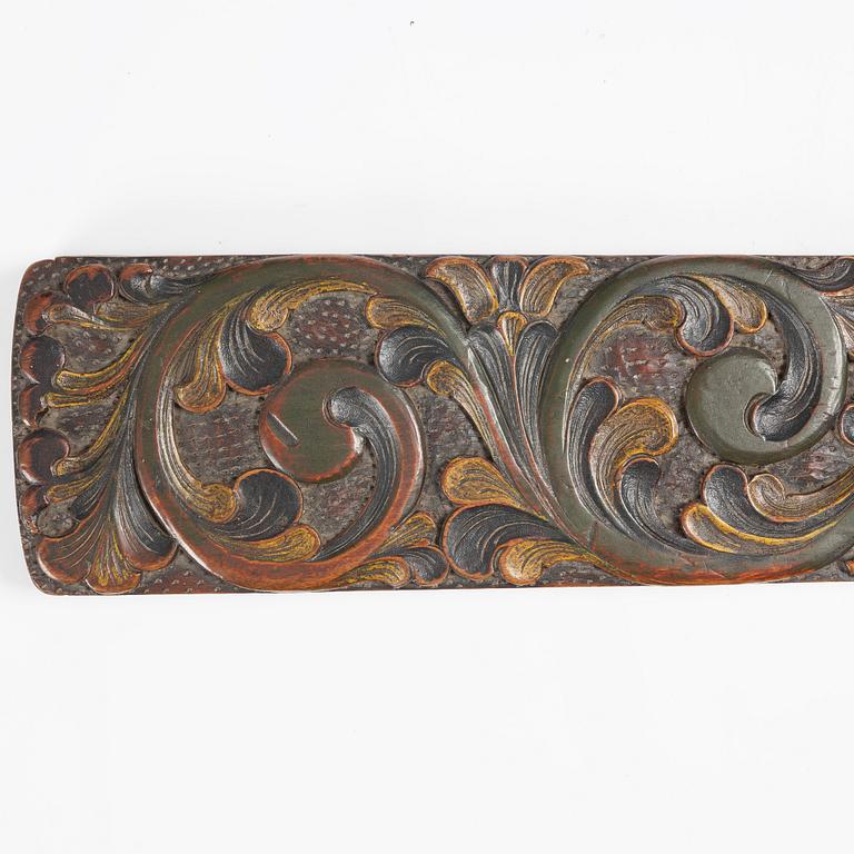 A carved and polychrome painted mangle board, Sweden, late 18th / early 19th century.