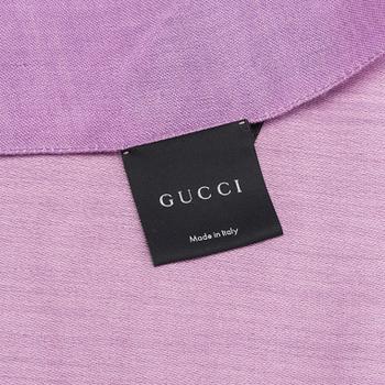 A Gucci scarf.