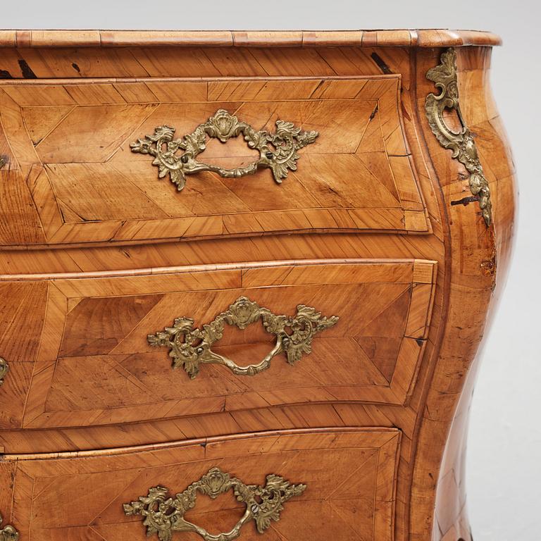 A brass-mounted and marquetry rococo commode, later part of the 18th century.