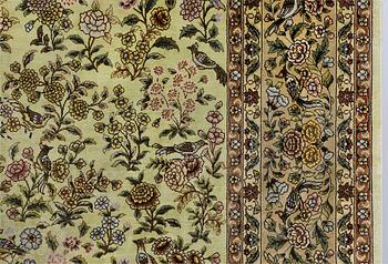 An Oriental silk rug, approx. 124 x 183 cm.