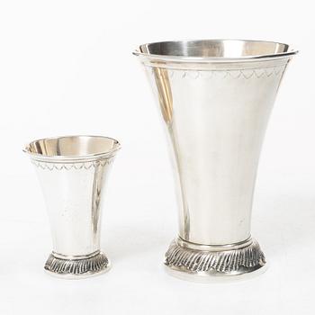 Two silver beakers and a bowl,