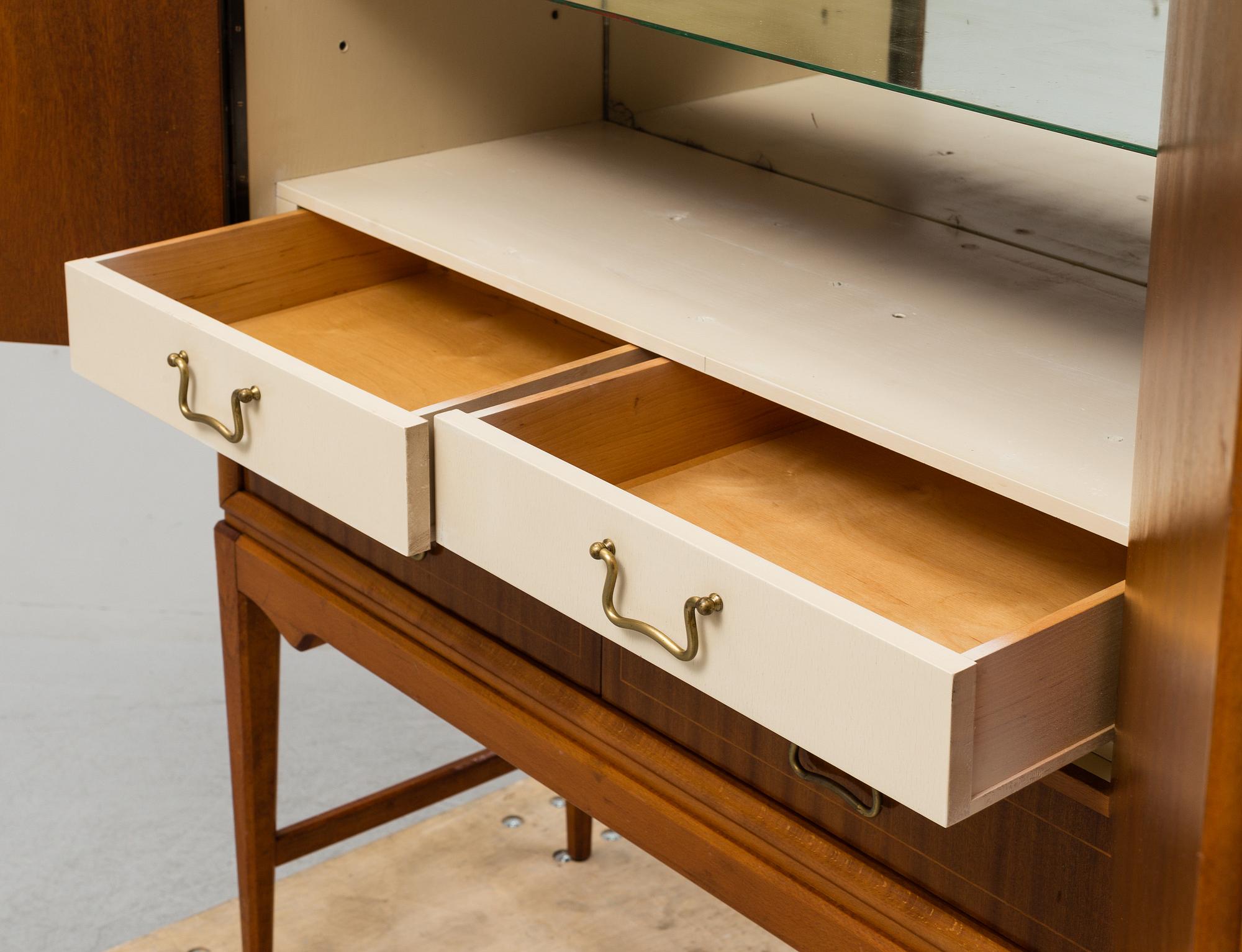 A mid 20th Century bar cabinet.