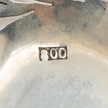 Two pierced silver bowls and two sugar spoons, including Sweden and Endland, 20th century.