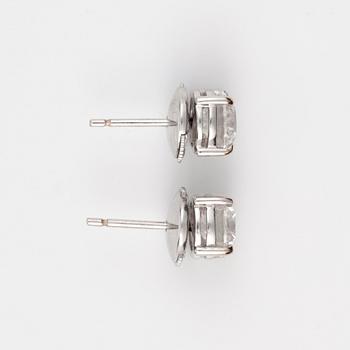A pair of brilliant-cut diamond solitaire earrings. Total carat weight 2.01 cts.