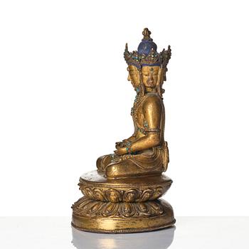 A Tibetan or Nepalese Gilt-Copper Alloy Figure of Sarvavid Vairocana, 15th century.