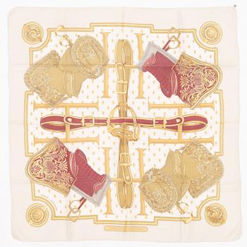 Hermès, a 'Selles a Housse' silk scarf.