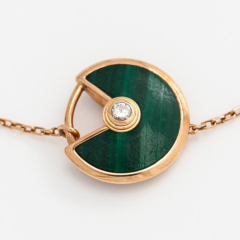 Cartier, an 18K gold "Amulette de Cartier" bracelet with malachite and a brilliant-cut diamond.