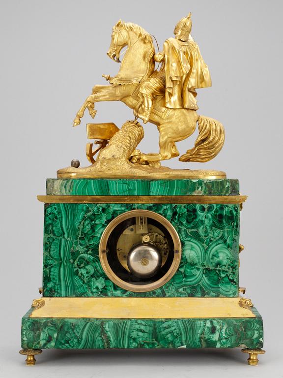 A French Malakit and gilt bronze mantel clock by Louis Japy, mid 19th century, for the Russian market.