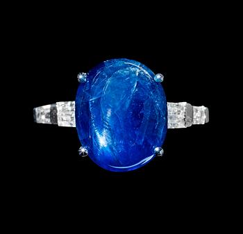 A cabochon-cut untreated star sapphire 10.76 cts and diamond, 0.35 ct, ring.