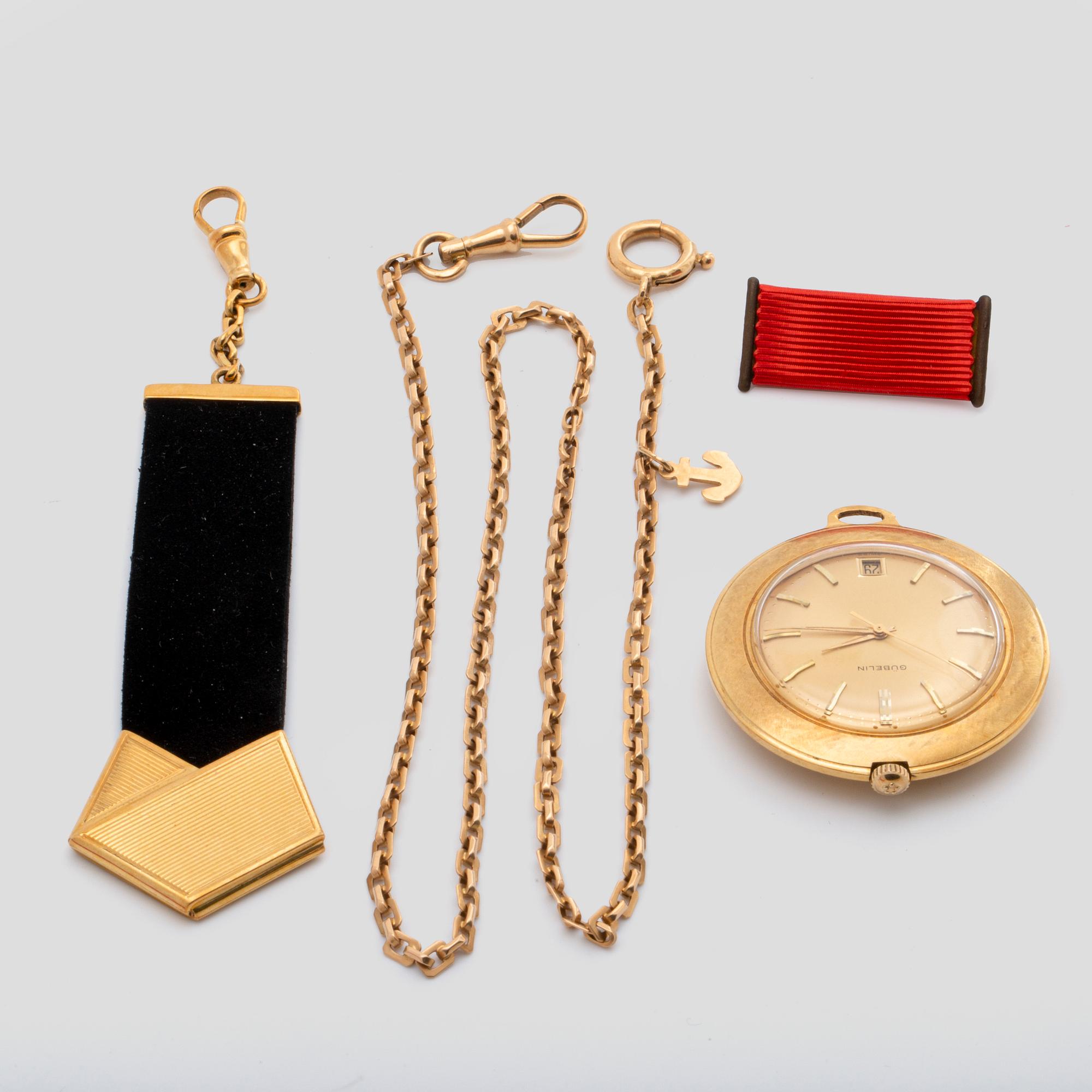 A Gübelin 18K gold pocket watch with chain and chatelaine, 40 mm.