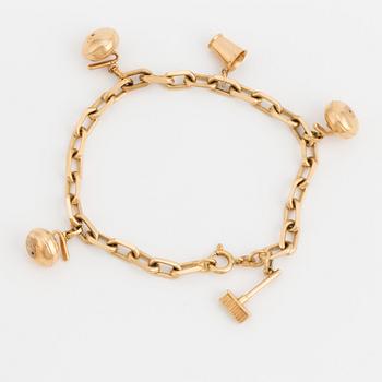 An 18K gold, cable-link charm-bracelet.