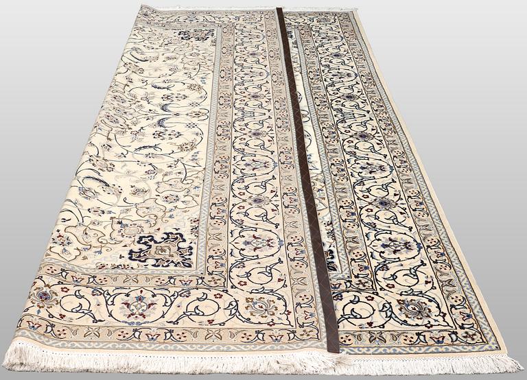 A Nain carpet, part silk, so-called 9 LAA, approx. 355 x 248 cm.