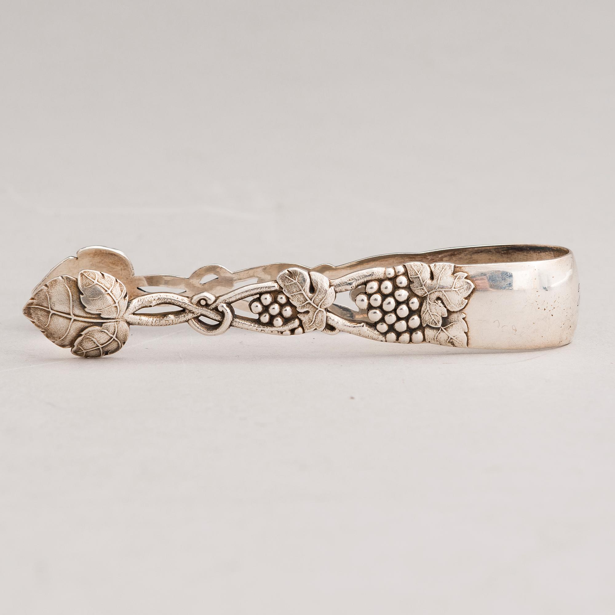 A silver sugar tong and a 3-piece silver coffee set, mark of Juho H. Pekuri, Oulu 1931 and Finnish import marks 1938.