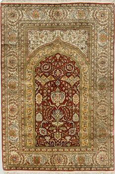 A RUG. An old silk Hereke Souf, 172 x 116 cm.