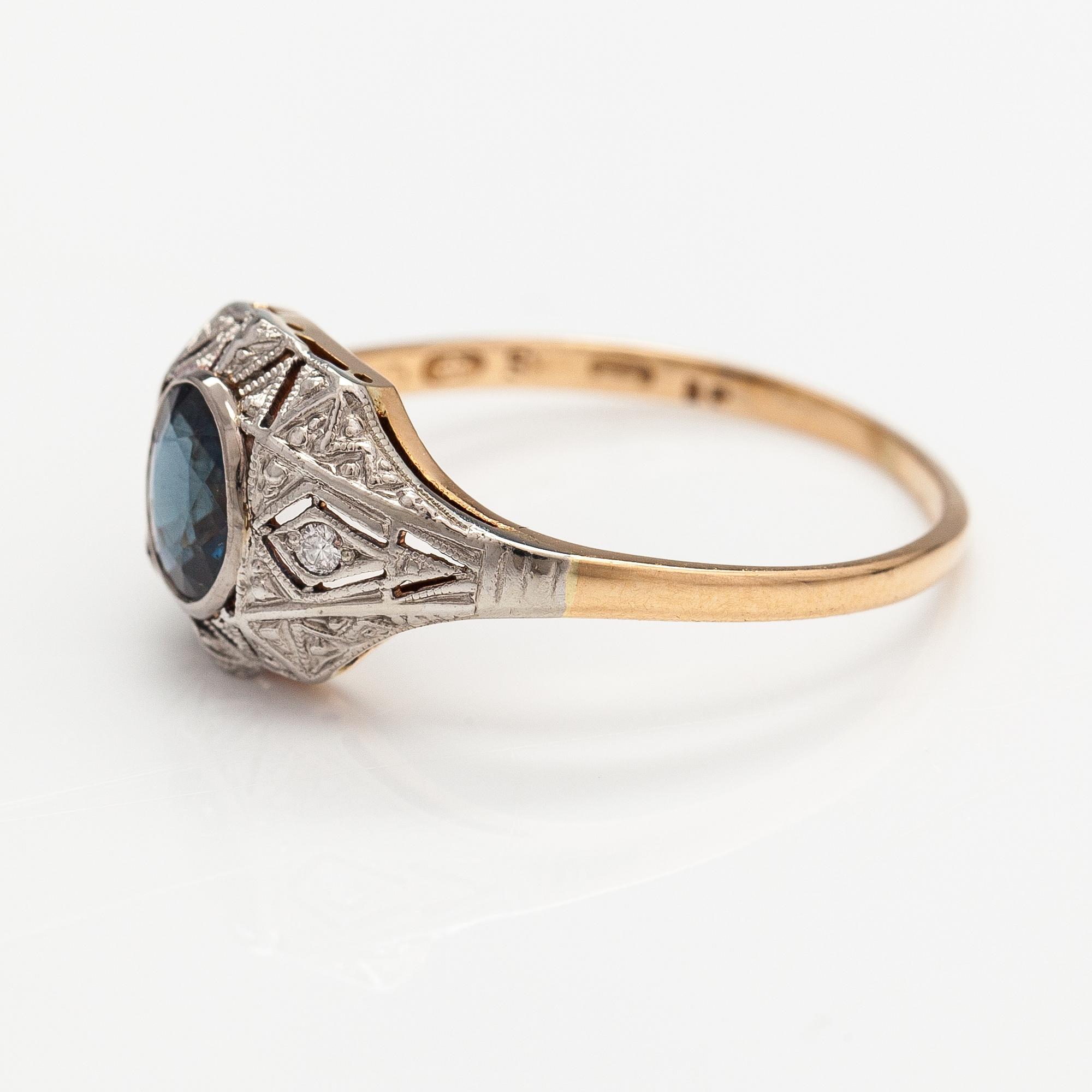 A 14K gold ring with diamonds ca. 0.02 ct in total and a sapphire. Finnish import marks.