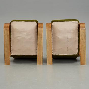 Alvar Aalto, a pair of  "Tank" easy chairs, "model 400", probably manaufactured by Aalto Design in Hedemora Sweden 1946-56.