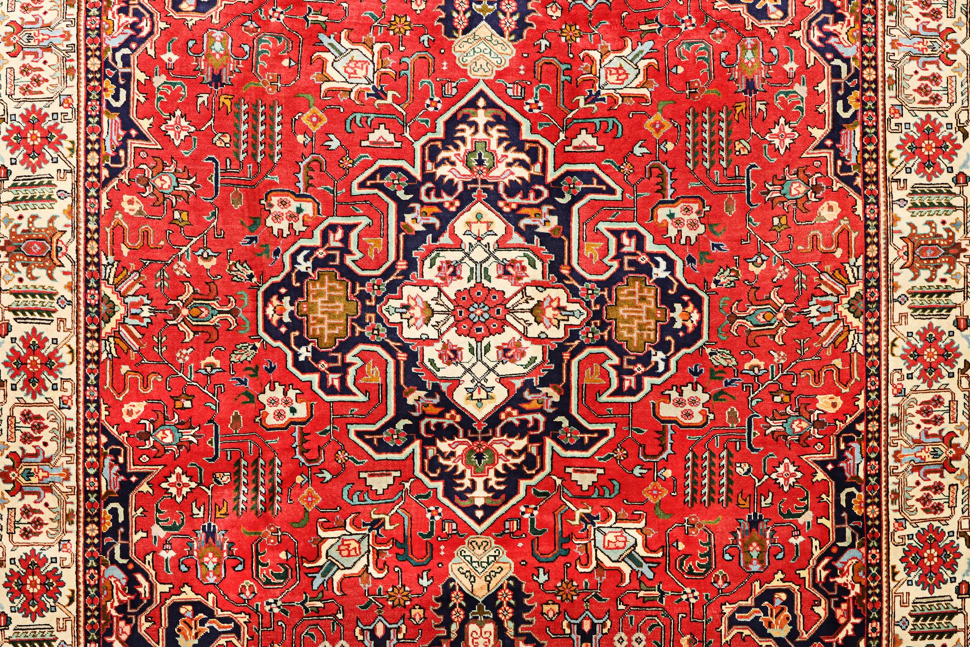 A Tabriz carpet, c. 335 x 257 cm.