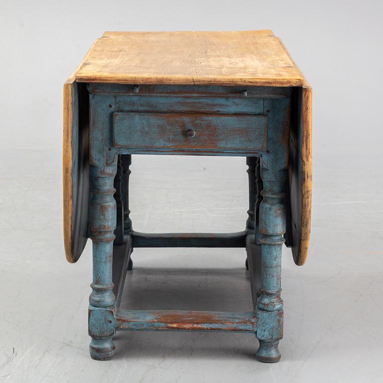 An 18th century baroque gate leg table.