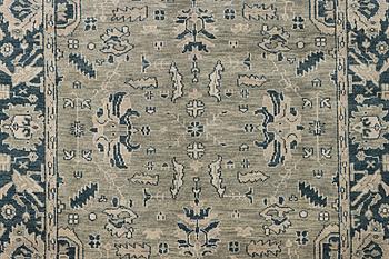 An oriental carpet with Mamluk design, c. 372 x 277 cm.