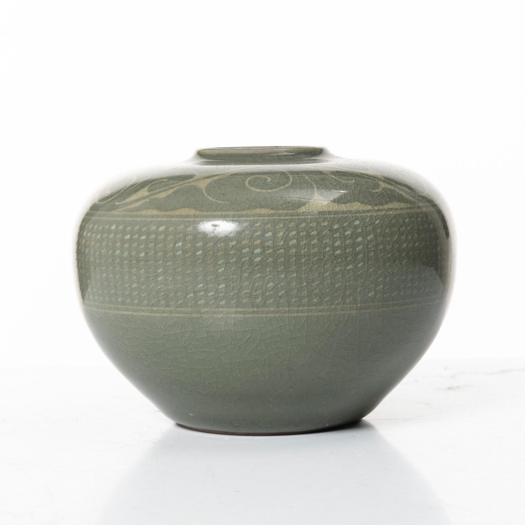 A Korean celadon glazed ceramic vase, 1900s.