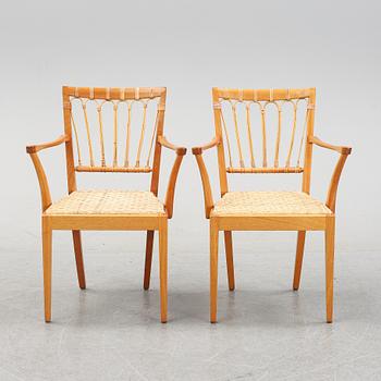 A pair of mahogany armchairs, model 1165, designed by Josef Frank in 1946 for Firma Svenskt Tenn.