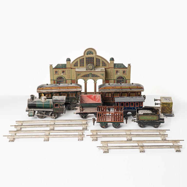 Model train with track and station building, 13 pieces, Germany, 1920s.