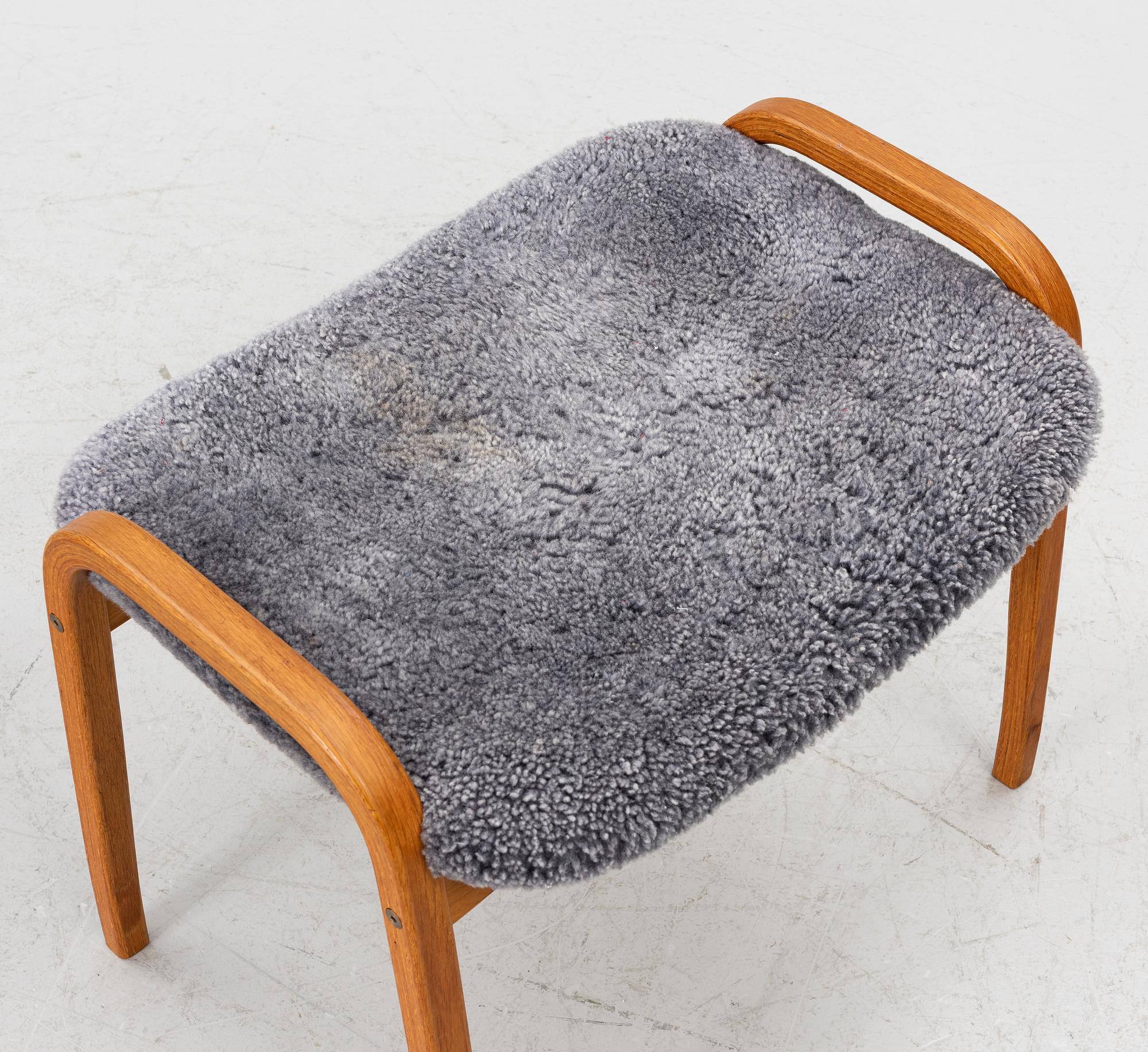 Yngve Ekström, a 'Lamino' armchair with footstool, Swedese, 2004.