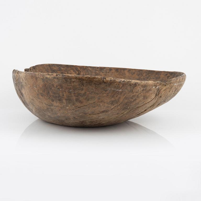 A wood bowl, dated 1765.