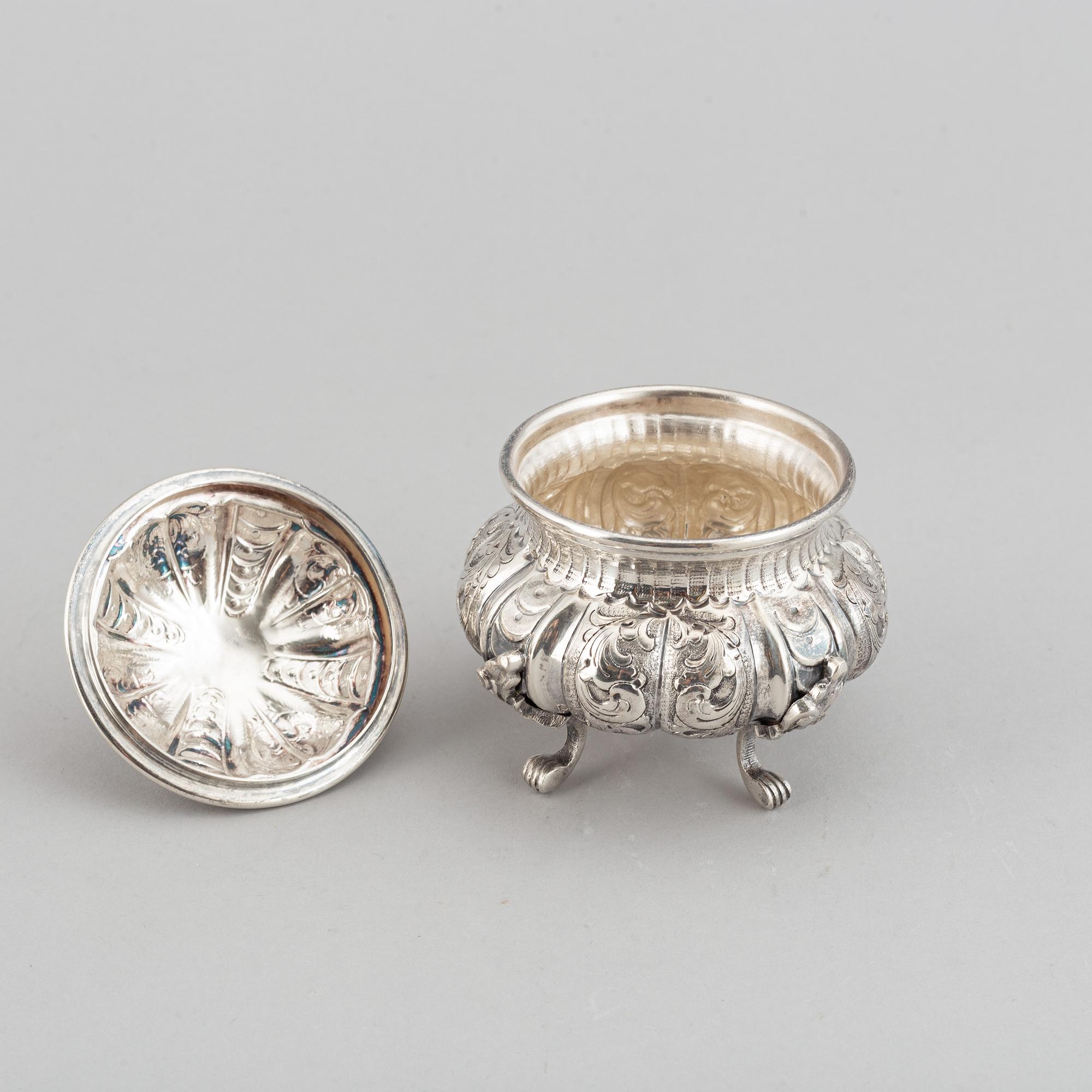 A silver teapot, creamer and sugar bowl, swedish import mark.