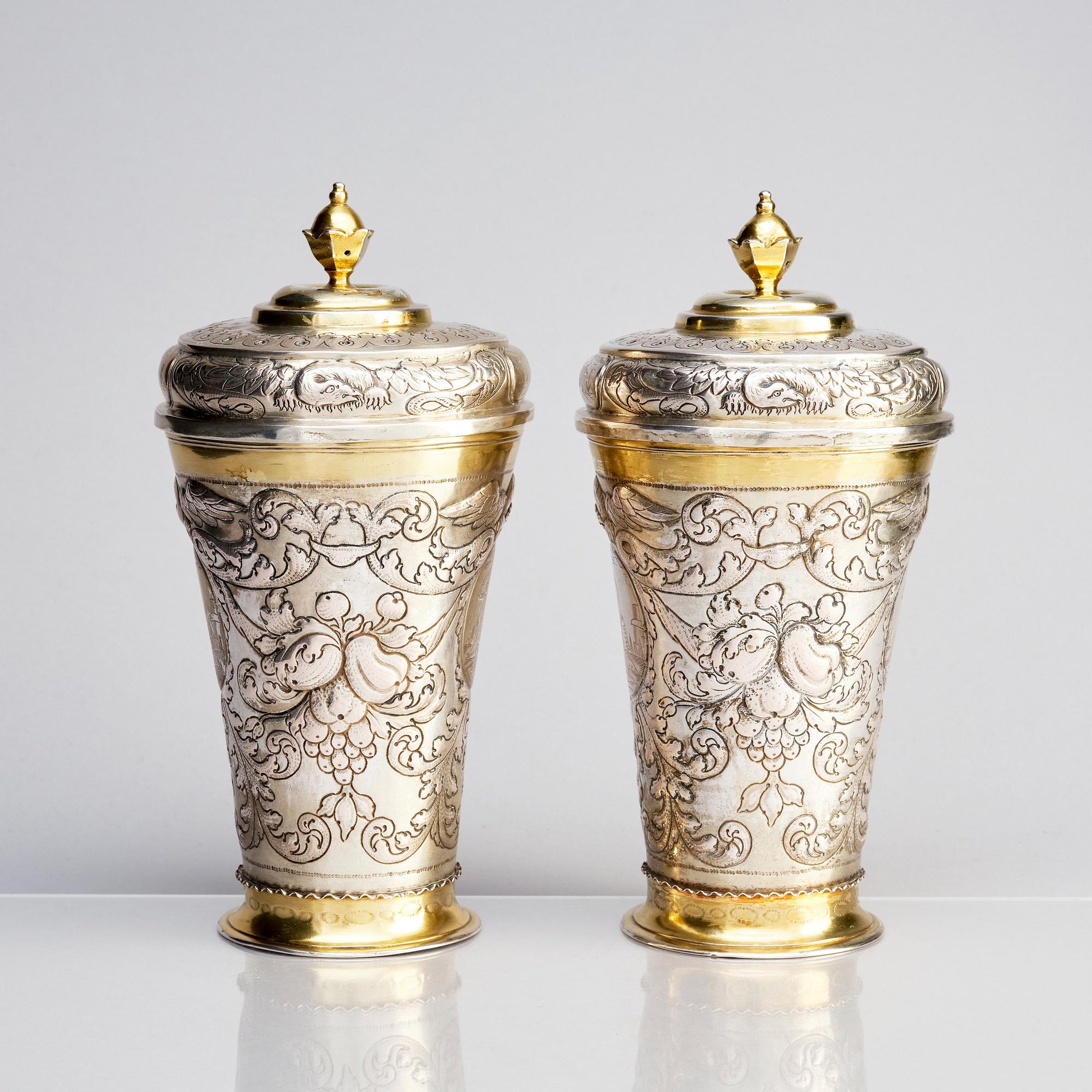 A pair of Russian Baroque parcel-gilt silver cups and covers, mark of Nikifor Timofeev, Moscow 1729.