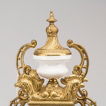 A LOUIS XVI STYLE GILT-BRASS CLOCK GRANITURE. Italy, SECOND HALF OF 20TH CENTURY.