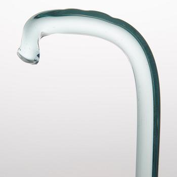 A greenish glass walking stick.
