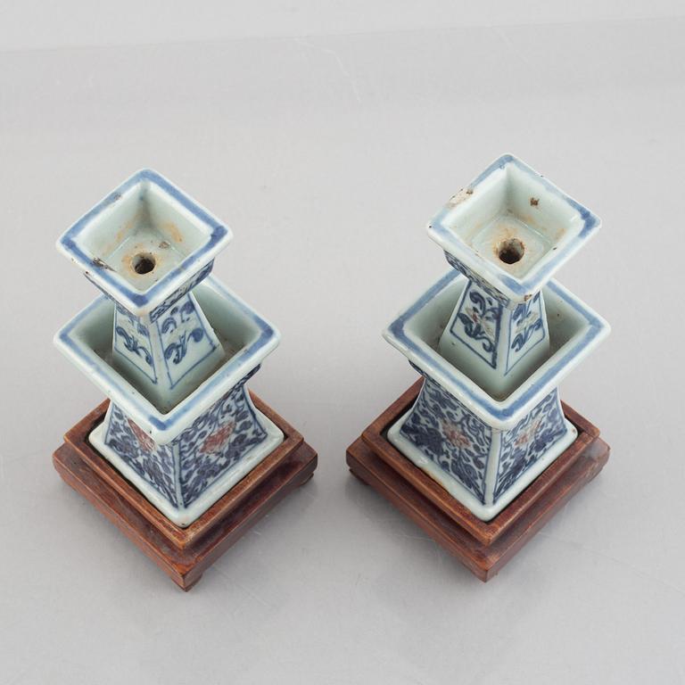 A pair of Chinese porcelain altar sticks, late Qing dynasty.
