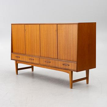 A mid20th century teak-veneered sideboard.