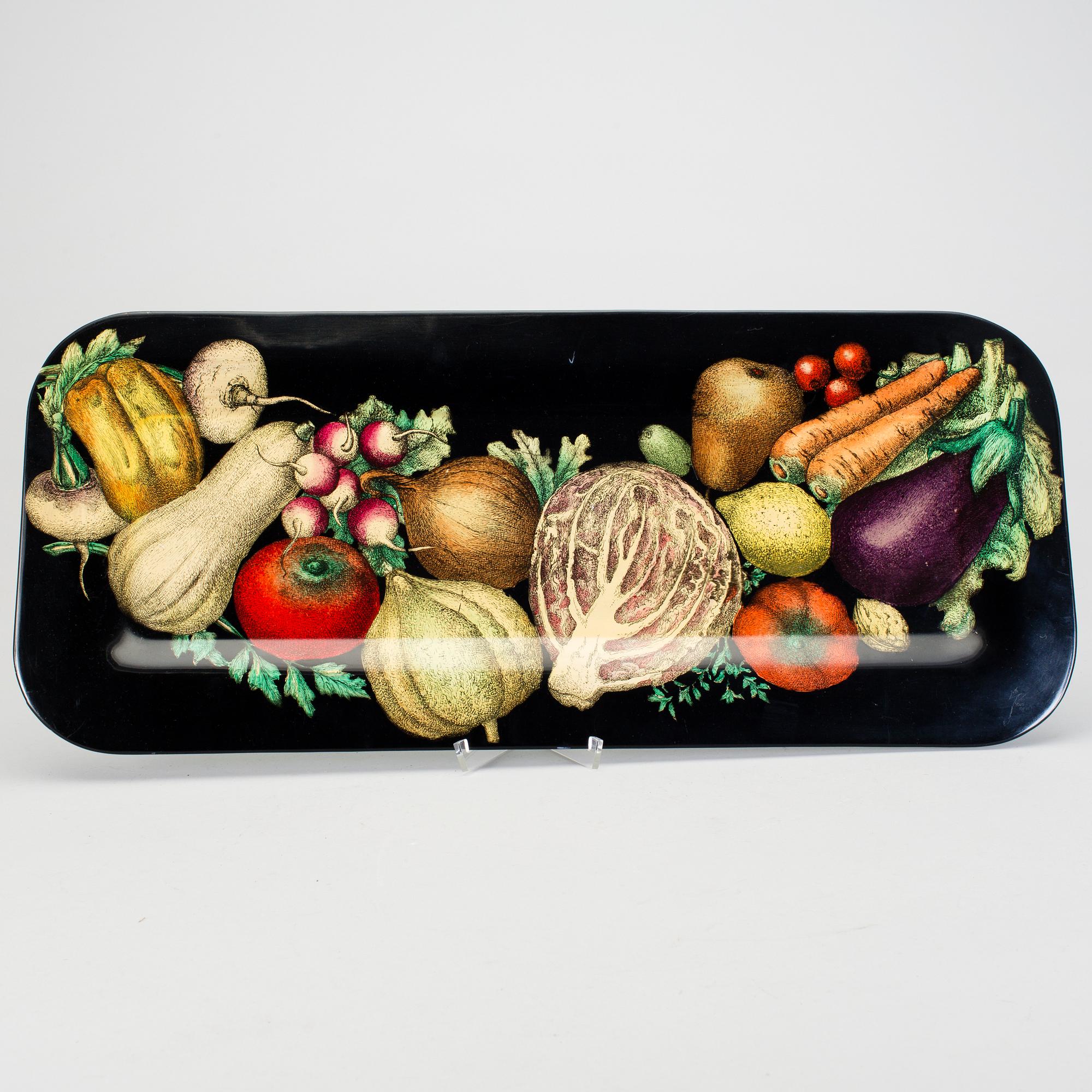 A Piero Fornasetti tray.