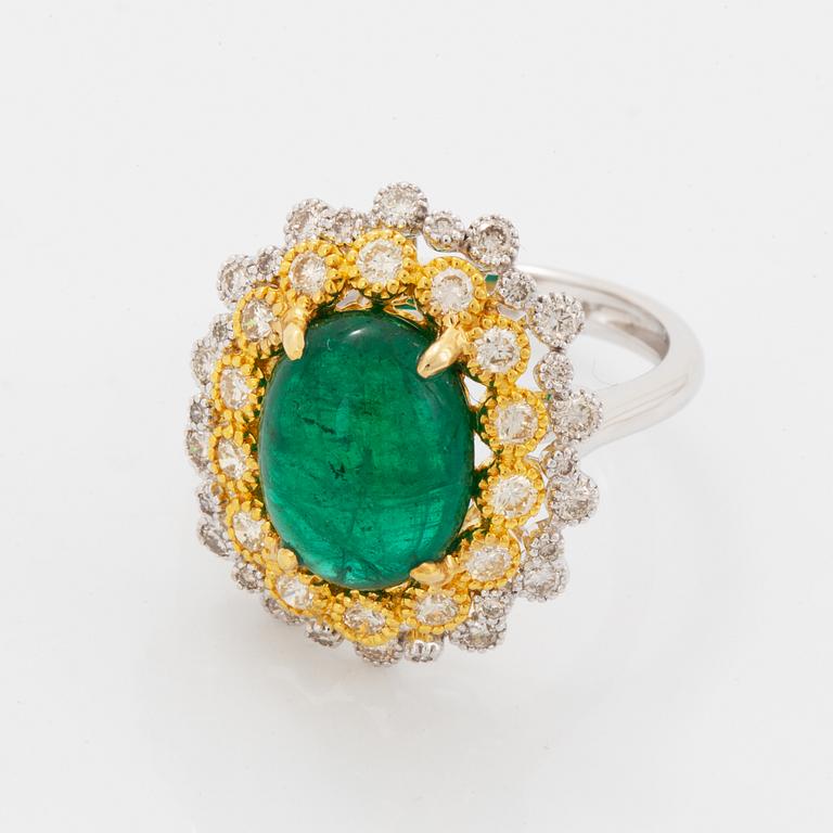 Cabochon-cut emerald and brilliant-cut diamond ring.