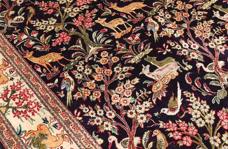 A silk Ghom rug, 155 x 100 cm.