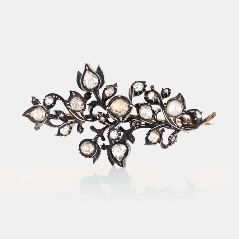 A brooch set with rose-cut  diamonds.