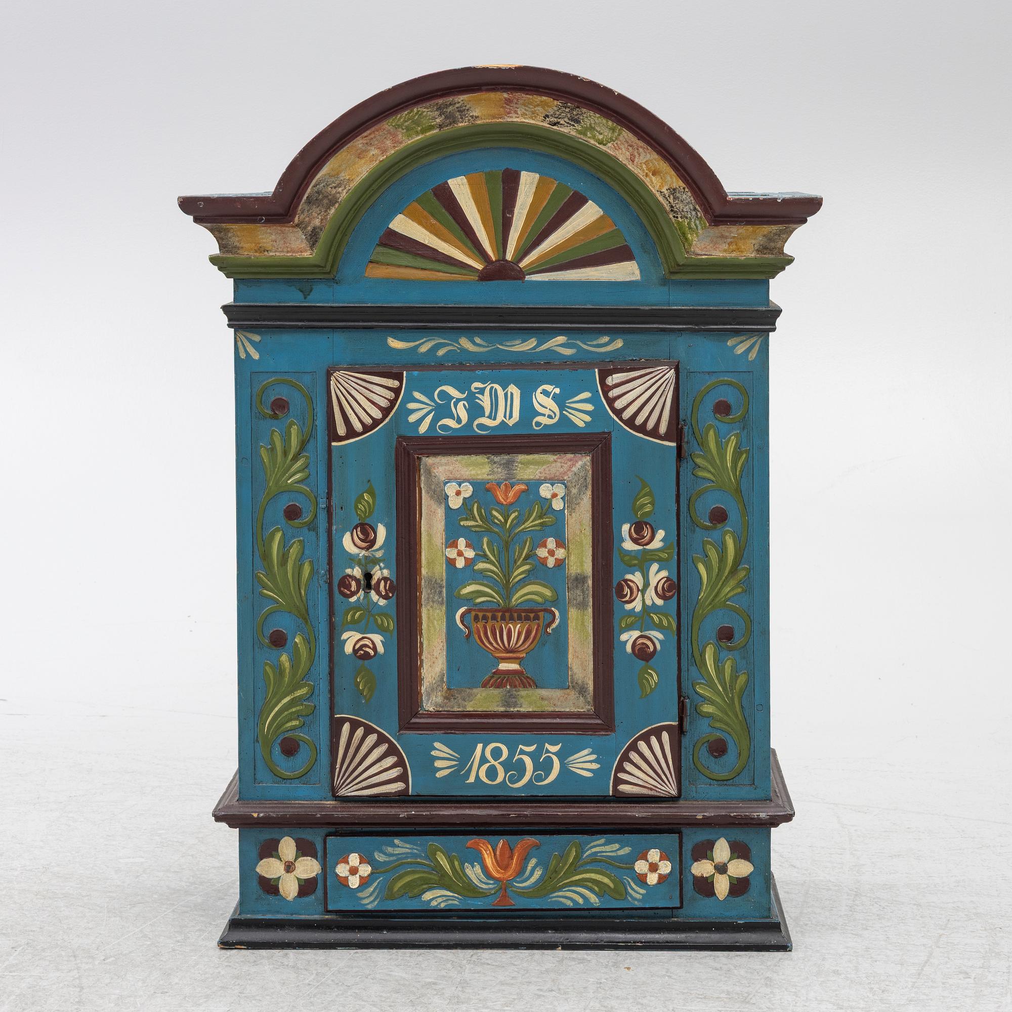 A 19th century folk art hanging cabinet.