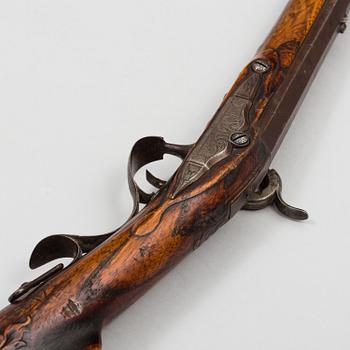 a 18th century rifle later made in to a percussion rifle signed by Lars Rånge, Jönköping.