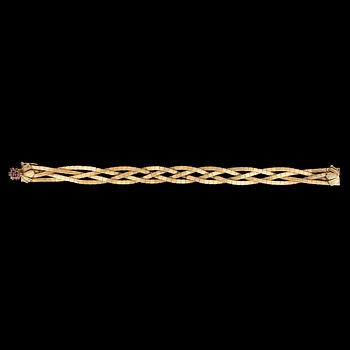 ARMBAND, 18k guld med 7 små rosa safirer, omkring 1900-talets mitt. Vikt ca 28,9 gram.