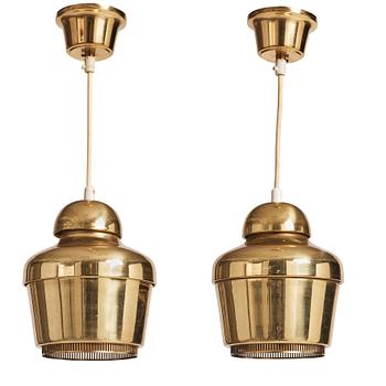 397. Alvar Aalto, a pair of "Golden Bell" brass pendant lamps, Valaistustyö, Finland, model "A330".