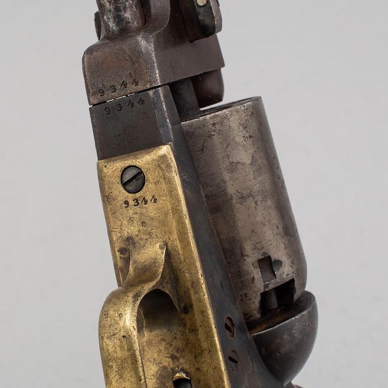 A Colt Dragoon percussion revolver no 9344 manufactured 1850.