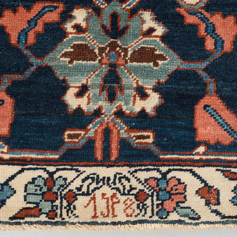 A CARPET, an antique Bakshaish, ca 693 x 398,5 cm, dated "1298"AH/1880 AD probably.